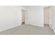 Well-lit bedroom with access to a bathroom and closet at 9 Timberlake Ct, Byers, CO 80103