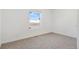 Bright bedroom with carpeted floor and large window at 9 Timberlake Ct, Byers, CO 80103