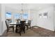 Bright dining room with bay window and wood floors at 9 Timberlake Ct, Byers, CO 80103