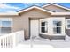 House exterior showcasing a front entrance and bay window at 9 Timberlake Ct, Byers, CO 80103