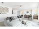 Spacious living room with sectional sofa and built-in shelving at 9 Timberlake Ct, Byers, CO 80103