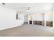 Open living room with built-in shelving and high ceilings at 9 Timberlake Ct, Byers, CO 80103