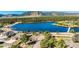 Beautiful aerial view of homes near a lake, nestled amid lush forests and mountains in the background at 17620 Leisure Lake Dr, Monument, CO 80132