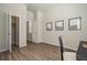 Neutral bedroom with wood floors features closet, updated windows, and space for home office setup at 17620 Leisure Lake Dr, Monument, CO 80132