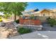 Entrance to a community of homes with a sign reading Lake of the Rockies at 17620 Leisure Lake Dr, Monument, CO 80132
