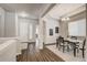 Elegant dining room with a chandelier, a large window, and wood floors, perfect for Gathering meals at 17620 Leisure Lake Dr, Monument, CO 80132