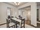 Elegant dining room with neutral walls, seamlessly connected to the kitchen and other living spaces at 17620 Leisure Lake Dr, Monument, CO 80132