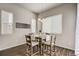 Bright dining area featuring an accent sign, stylish furniture, and natural light at 17620 Leisure Lake Dr, Monument, CO 80132