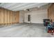 Spacious garage with overhead lighting and concrete floors at 17620 Leisure Lake Dr, Monument, CO 80132
