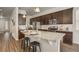 Spacious kitchen with dark cabinetry, a granite countertop island, and stainless steel appliances, perfect for cooking at 17620 Leisure Lake Dr, Monument, CO 80132