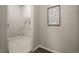 Well-lit laundry room offers ample space and shelving for your laundry storage needs at 17620 Leisure Lake Dr, Monument, CO 80132