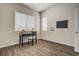An office with a black desk and chair, a window, and laminate flooring at 17620 Leisure Lake Dr, Monument, CO 80132
