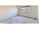 Bright bedroom features a window that provides natural light and outdoor views at 12625 Madison Way, Thornton, CO 80241