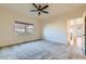 Cozy bedroom with neutral carpet and window, offering a peaceful retreat with ample natural light at 12625 Madison Way, Thornton, CO 80241