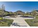 Scenic outdoor gazebo surrounded by lush landscaping and walkways at 12625 Madison Way, Thornton, CO 80241