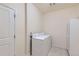 Functional laundry room equipped with a washing machine and dryer at 12625 Madison Way, Thornton, CO 80241