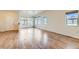 Spacious living room with hardwood floors and multiple windows at 12625 Madison Way, Thornton, CO 80241