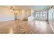 Open-concept living area featuring hardwood floors and abundant natural light at 12625 Madison Way, Thornton, CO 80241