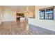 Expansive living room with hardwood floors, open layout, and natural light at 12625 Madison Way, Thornton, CO 80241