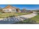Community pool featuring a secure fence, ample seating, and manicured landscaping at 12625 Madison Way, Thornton, CO 80241