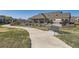 Exterior community pool and lounging area offering residents relaxation and recreation at 12625 Madison Way, Thornton, CO 80241