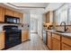 Efficient kitchen with granite countertops, modern appliances, and ample cabinet space, ideal for cooking and meal prep at 16420 Martingale Dr, Parker, CO 80134
