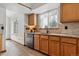 Well-lit kitchen with granite countertops, modern appliances, and stylish backsplash, offering functionality and style at 16420 Martingale Dr, Parker, CO 80134