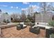 Charming brick patio featuring a comfortable seating area, perfect for outdoor relaxation and entertaining at 16420 Martingale Dr, Parker, CO 80134