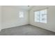 Bedroom featuring neutral walls, newer carpet, and good natural light from windows at 2552 W 82Nd Ln # C, Westminster, CO 80031