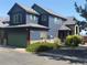View of two-story home with green garage door and shutters at 2552 W 82Nd Ln # C, Westminster, CO 80031