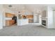 Open living space with a fireplace, seamlessly connected to the kitchen with vaulted ceilings and modern design at 2552 W 82Nd Ln # C, Westminster, CO 80031