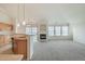 Open floor plan combining the kitchen, dining, and living areas, featuring a fireplace at 2552 W 82Nd Ln # C, Westminster, CO 80031