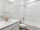 Clean bathroom featuring a shower-tub, white subway tile, and single sink vanity at 564 Penn Rd, Elizabeth, CO 80107