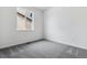 Cozy bedroom featuring great natural light from the window and patterned gray carpet at 564 Penn Rd, Elizabeth, CO 80107