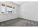 Bright bedroom with large windows providing great natural light and gray patterned carpet at 564 Penn Rd, Elizabeth, CO 80107
