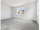 Bright bedroom with large windows, carpet flooring, and neutral walls at 564 Penn Rd, Elizabeth, CO 80107
