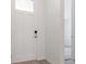 Bright entryway with a white front door with glass, white walls, and wood-look flooring at 564 Penn Rd, Elizabeth, CO 80107