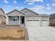 Beautiful single Gathering home with a 3-car garage, landscaped front, and covered porch at 564 Penn Rd, Elizabeth, CO 80107