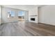 Open living room with a fireplace, recessed lighting, and sliding glass doors to let in natural light at 564 Penn Rd, Elizabeth, CO 80107
