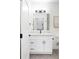 Charming bathroom with modern vanity, featuring black hardware, quartz countertop, and a mirror; a clean inviting space at 385 East St, Louisville, CO 80027