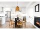 Open kitchen with white cabinets, stainless steel appliances, and adjacent dining area at 385 East St, Louisville, CO 80027