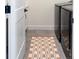 Neat laundry room boasting a modern washer/dryer set and a stylish patterned rug on top of the tile flooring at 385 East St, Louisville, CO 80027
