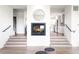 Open-concept living area featuring a fireplace and seamless transition to the modern kitchen at 385 East St, Louisville, CO 80027