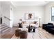 Bright living room featuring modern decor, a neutral color palette, and stylish furnishings at 385 East St, Louisville, CO 80027