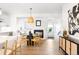 Open-concept living room with fireplace and modern decor. Light-colored wood floors throughout at 385 East St, Louisville, CO 80027