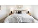 Bright main bedroom featuring soft natural light, neutral color palette, and modern decor at 385 East St, Louisville, CO 80027