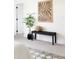Relaxing main bedroom area features a bench and stylish artwork at 385 East St, Louisville, CO 80027