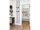 Walk-in pantry with shelving for ample storage; wine storage adjacent to pantry at 385 East St, Louisville, CO 80027