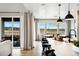 Kitchen with island, seating, and outdoor views from the attached breakfast area at 8958 Whiteclover St, Littleton, CO 80125