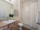 Bathroom with tub/shower combo, framed art, and single sink vanity at 15496 W 66Th Dr # B, Arvada, CO 80007